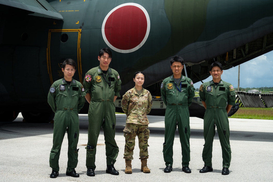 Japan Air Self-Defense Force service members pose with U.S. Air Force 2nd Lt. Julie Tatemoto and Language Enabled Airman Program participant, 51st Operations Support Squadron airfield operations director of operations, Osan Air Base, South Korea, during the U.S. Air Force’s 2025 Department-Level Exercise series at Andersen Air Force Base, Guam, July 22, 2025. LEAP empowers the DLE by enhancing linguistic and cultural interoperability, enabling more effective collaboration and mission success with partners and allies. DLE 2025 is a new way of conducting operations in a contested, dynamic environment to build capabilities, making a stronger, more deterrent force. The DLE encompasses all branches of the Department of Defense, along with Allies and partners, employing more than 400 Joint and coalition aircraft and more than 12,000 members at more than 50 locations across 3,000 miles. (U.S. Air Force photo by Senior Airman Jade M. Caldwell)