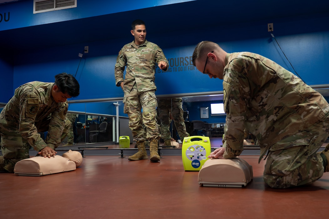 U.S. Air Force Senior Airman Nicolas Vazquez talks augmentees through CPR during a training at Scott AFB.