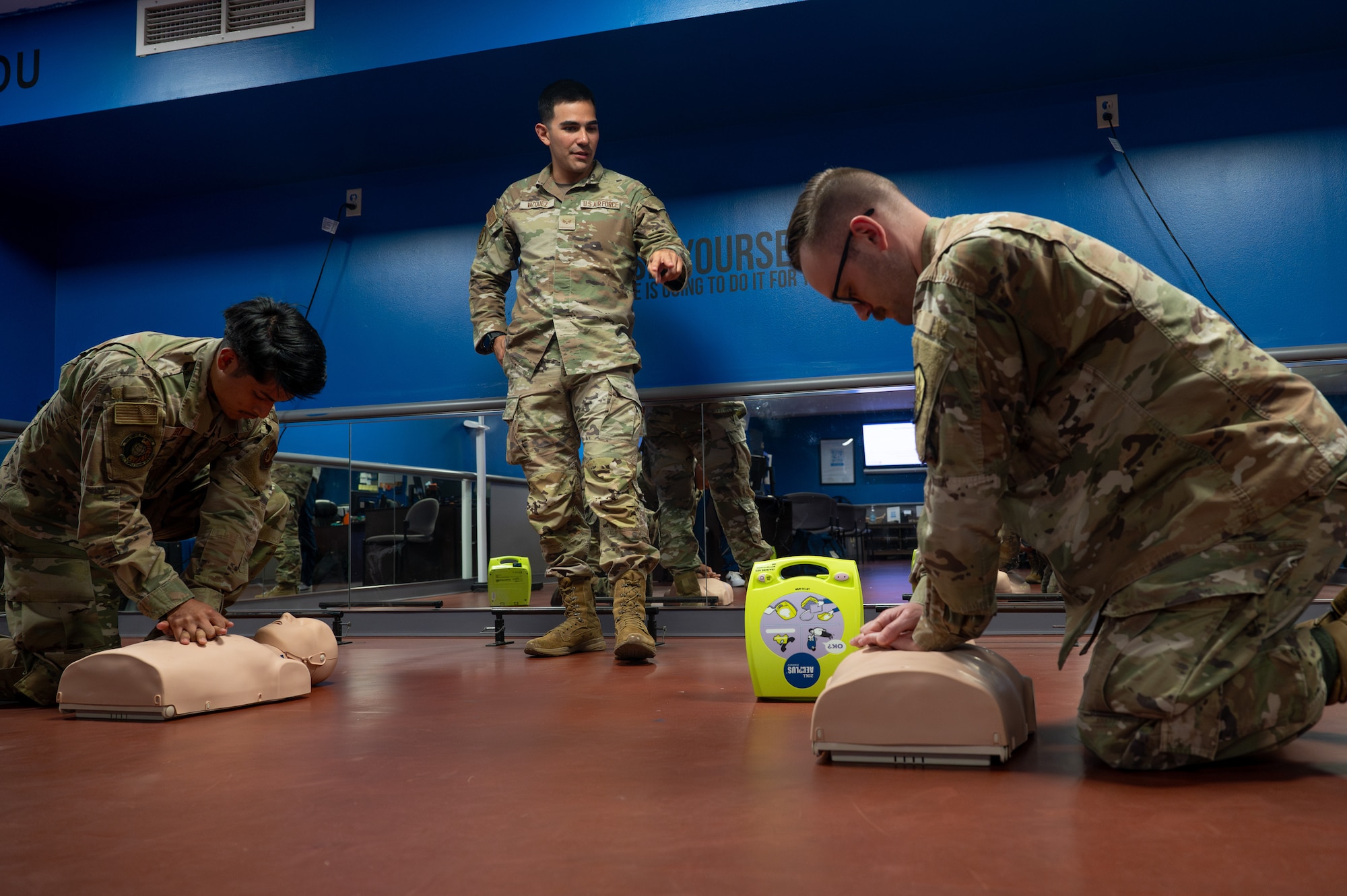 U.S. Air Force Senior Airman Nicolas Vazquez talks augmentees through CPR during a training at Scott AFB.