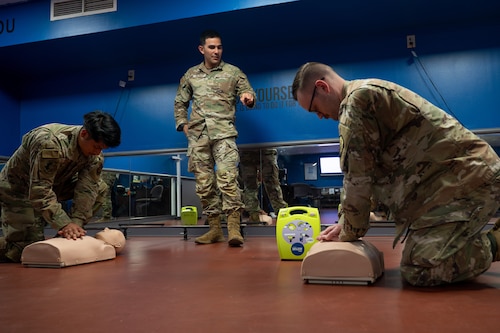 U.S. Air Force Senior Airman Nicolas Vazquez talks augmentees through CPR during a training at Scott AFB.