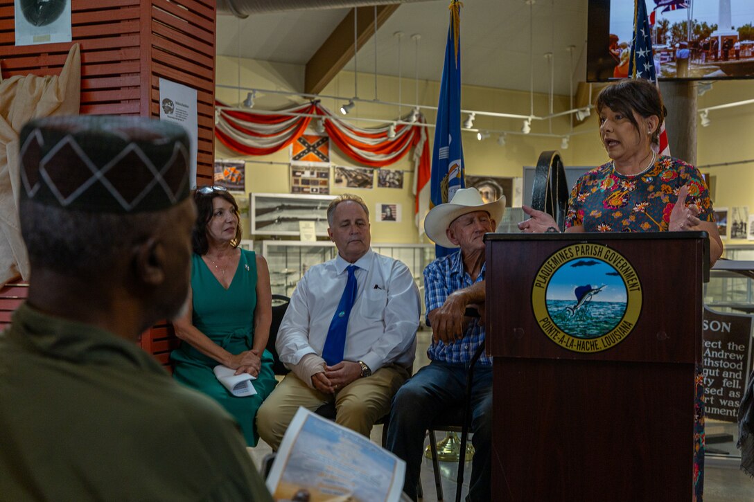 Mrs. Justine Demolle, a Plaquemines Parish business owner, shares her testimony at the 20th anniversary of the Annual Hurricane Katrina Remembrance at the Fort Jackson Museum Welcome Center, Buras, Louisiana, Aug. 29, 2025. The 20th anniversary honored the resilience of those who continue to thrive 20 years later. (U.S. Marine Corps photo by Sgt. Aaron TorresLemus)