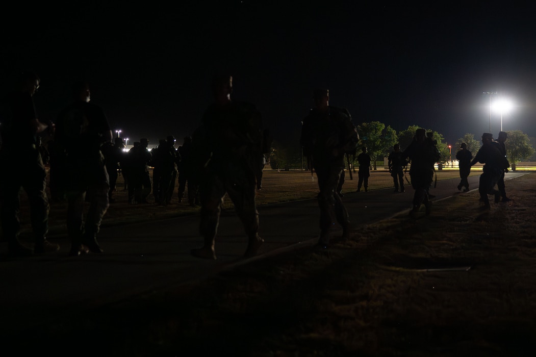 U.S. Army soldiers attached to the 344th Military Intelligence Battalion form up for a ruck during the 9/11 Memorial Physical Training Event at Goodfellow Air Force Base