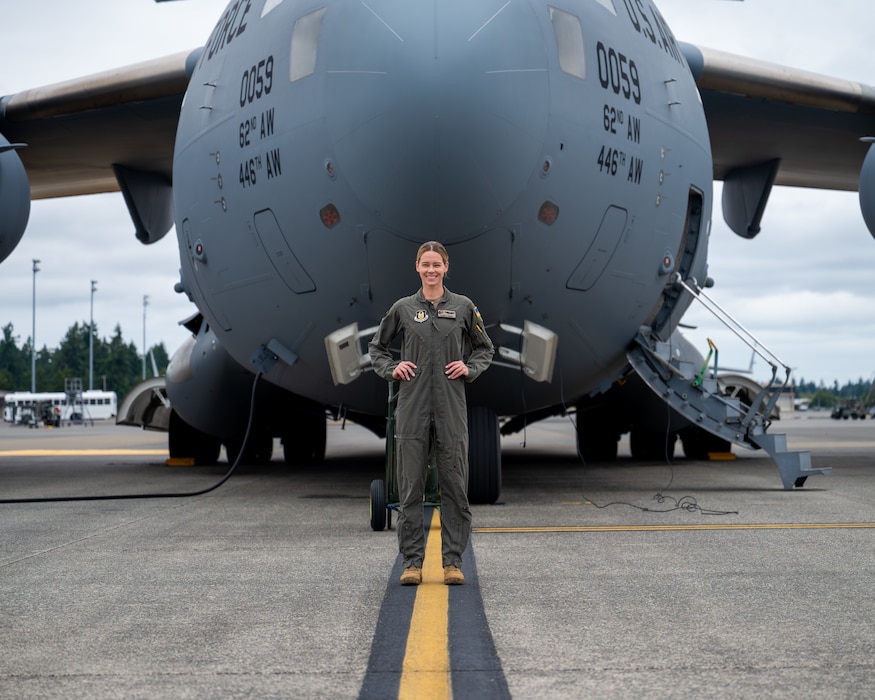 Capt. Cassidy Pickrell poses for a picture in front of the C-17 Globemaster III, on Aug 3, 2025, at Joint Base Lewis-McChord, Washington. Pickrell currently pilots the C-17 Globemaster III for the 313th Airlift Squadron.