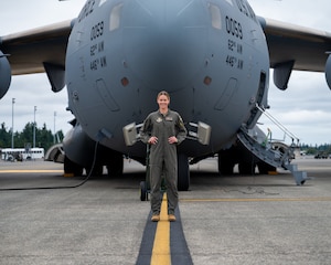 Capt. Cassidy Pickrell poses for a picture in front of the C-17 Globemaster III, on Aug 3, 2025, at Joint Base Lewis-McChord, Washington. Pickrell currently pilots the C-17 Globemaster III for the 313th Airlift Squadron.