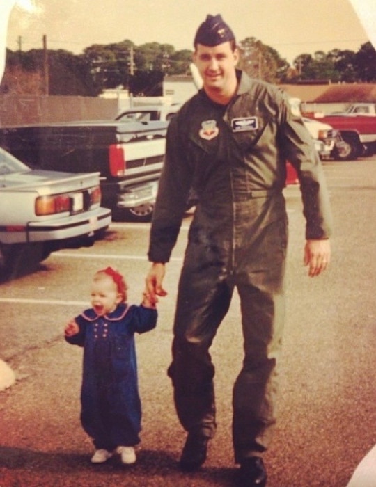 Capt. Cassidy Pickrell, as a child, and her father Capt. Robert Pickrell Jr., now retired, pose for a picture outside the 53rd Weather Reconnaissance Squadron, at Keesler Air Force Base, Mississippi. Cassidy currently pilots the C-17 Globemaster III for the 313th Airlift Squadron at Joint base Lewis McChord.