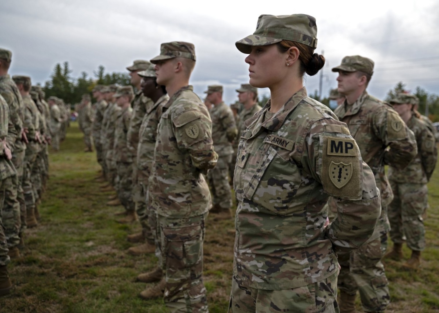 Spc. Brianna Coombs, 237th Military Police Company, New Hampshire Army National Guard, stands in formation during a departure ceremony