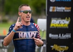 Navy Cmdr. Kyle Hooker crosses the finish line to win his eighth Armed Forces Triathlon championship in San Diego on Sept. 13, 2025. (U.S. Armed Forces Sports phot by Mass Communications Specialist First Class Colby Mothershead - released)