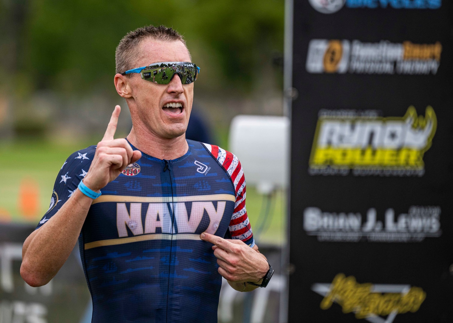Navy Cmdr. Kyle Hooker crosses the finish line to win his eighth Armed Forces Triathlon championship in San Diego on Sept. 13, 2025. (U.S. Armed Forces Sports phot by Mass Communications Specialist First Class Colby Mothershead - released)
