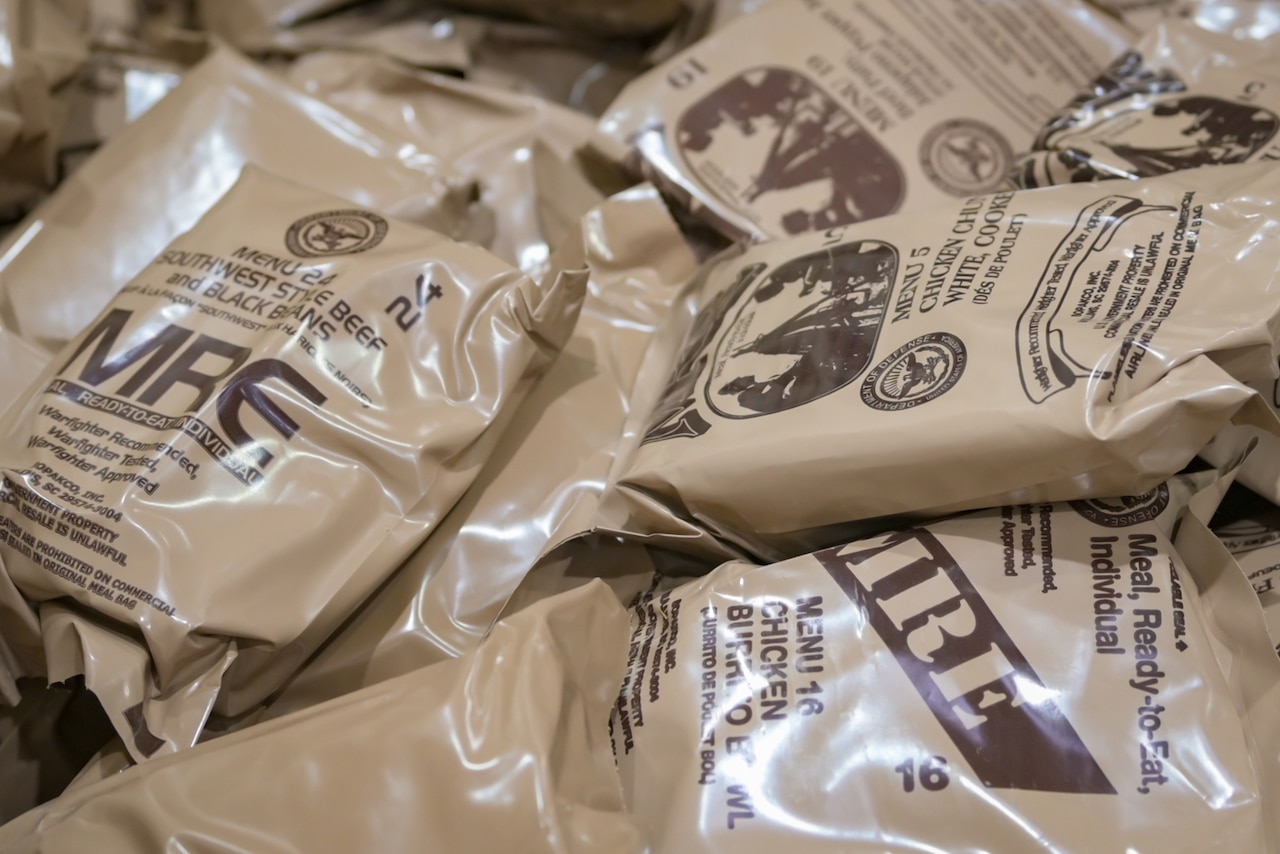 Several packaged items are piled on top of each other.