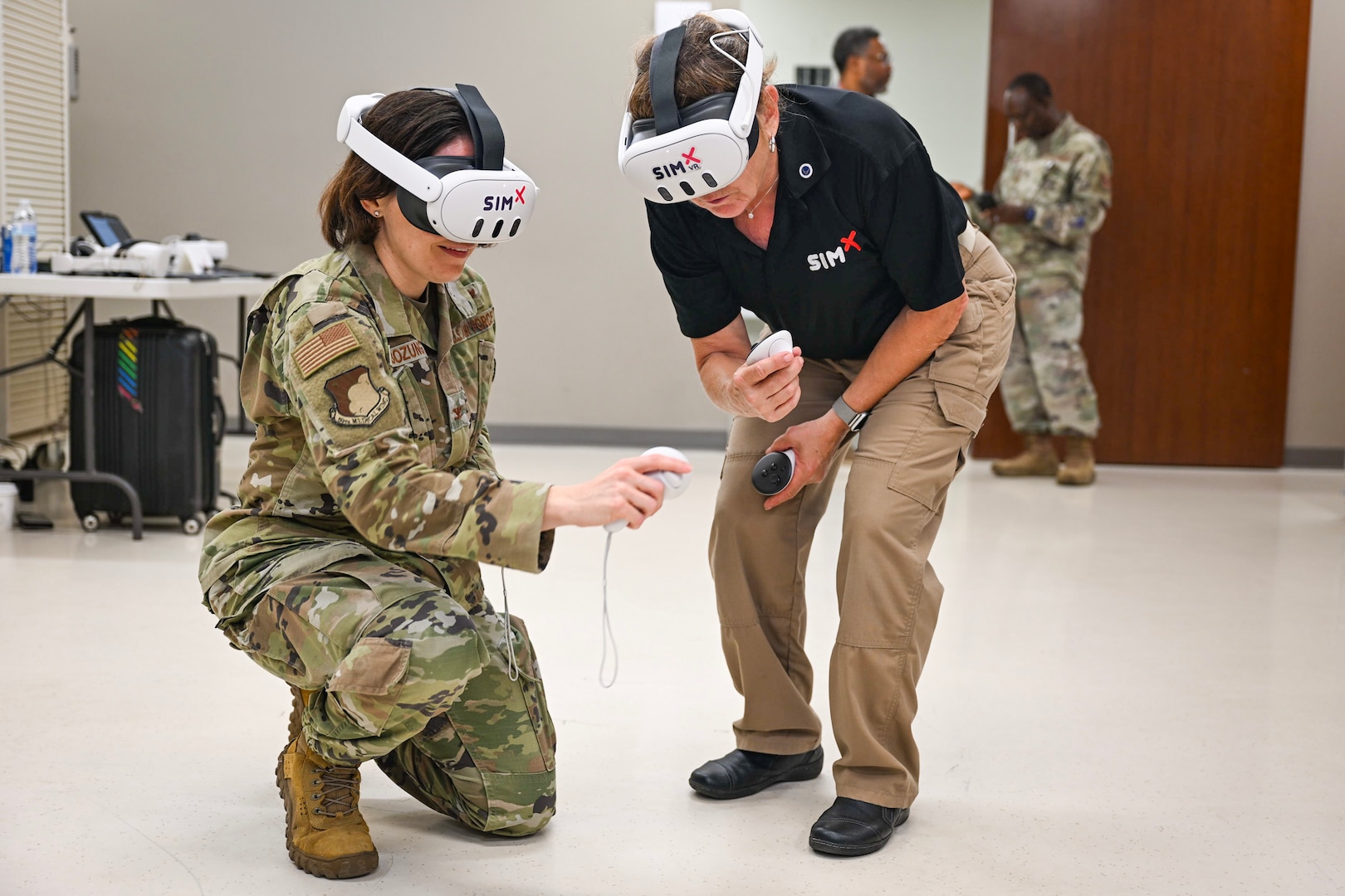 Col. Tracy Bozung, 59th Medical Wing deputy commander works with Retired Col. Cheryl Lockhart, senior military advisor for SimX, during a demonstration of SimX’s Virtual Reality Operational Medical Training at Wilford Hall Ambulatory Surgical Center, Joint Base San Antonio-Lackland, Texas, Sept. 5, 2025.