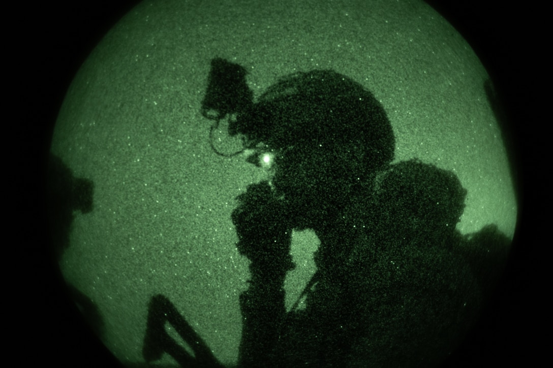 A marine with Infantería de Marina (Spanish marine corps) communicates with other Marines during a night raid as part of UNITAS 2025 at Marine Corps Outlying Field Atlantic, North Carolina, Sep. 13, 2025. UNITAS, which is Latin for “unity,” was conceived in 1959 and has taken place annually since first conducted in 1960. This marks the 66th iteration of the world’s longest running annual multinational maritime exercise. (U.S. Marine Corps photo by Cpl. Osmar VasquezHernandez)