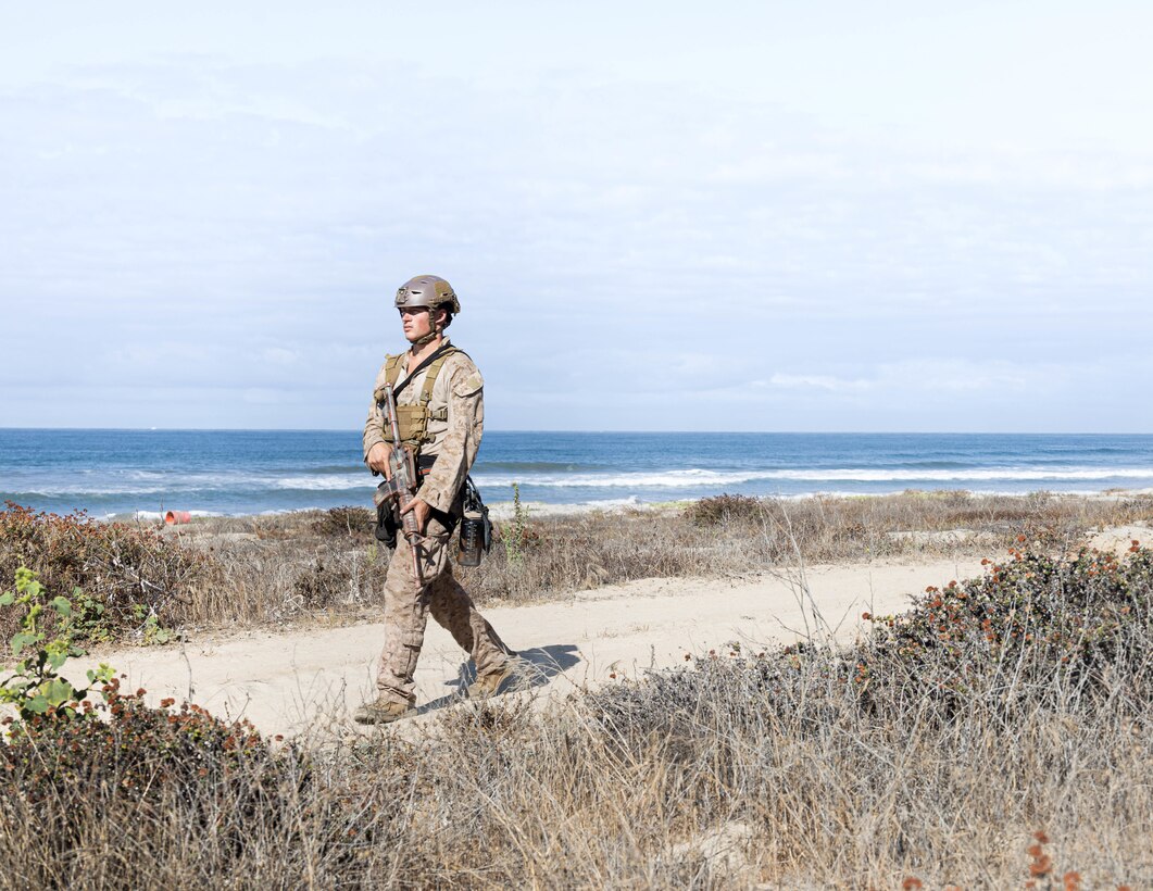 U.S. Marine Corps Cpl. Brendon Hall, a rifleman with Battalion Landing Team 3/5, 11th Marine Expeditionary Unit, patrols during Assault Climbers Course 25-3 at Marine Corps Base Camp Pendleton, California, Sept. 11, 2025. ACC is a multi-week course that exposes students to rope climbing techniques and procedures, increasing mobility and lethality in littoral, mountainous and urban terrain. (U.S. Marine Corps photo by Lance Cpl. Luke Rodriguez)