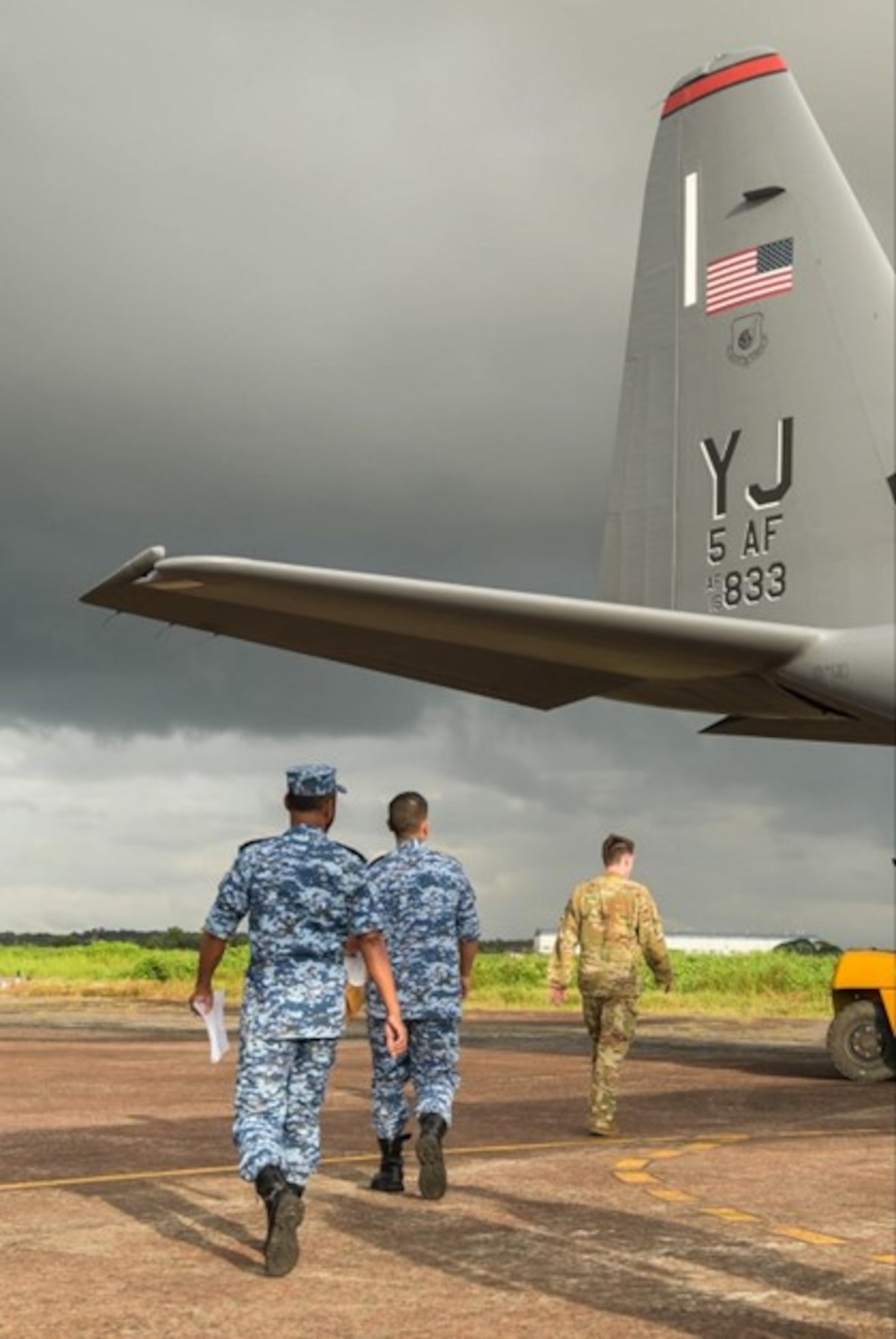A United States Air Force crew chief along with Bangladeshi Air Force members conduct a post flight inspection after landing a C-130J Hercules during Pacific Angel 25-3 at BAF Base Zahrul Haque in Chittagong, Bangladesh, Sept 12, 2025.