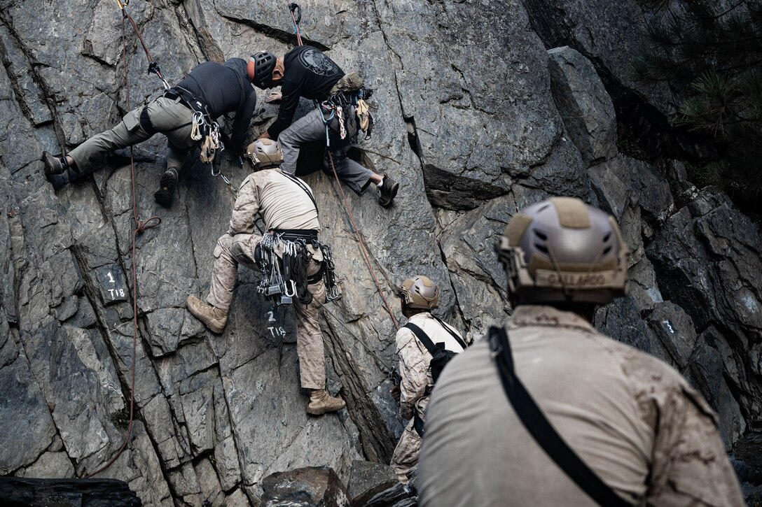 U.S. Marines with 3rd Battalion, 5th Marine Regiment, 1st Marine Division, I Marine Expeditionary Force, perform mock lead climbing techniques during Assault Climbers Course 25-3 at Marine Corps Mountain Warfare Training Center Bridgeport, California, Aug. 24, 2025. ACC is a multi-week course that exposes students to rope climbing techniques and procedures, increasing mobility and lethality in littoral, mountainous and urban terrain. (U.S. Marine Corps photo by Lance Cpl. Luke Rodriguez)