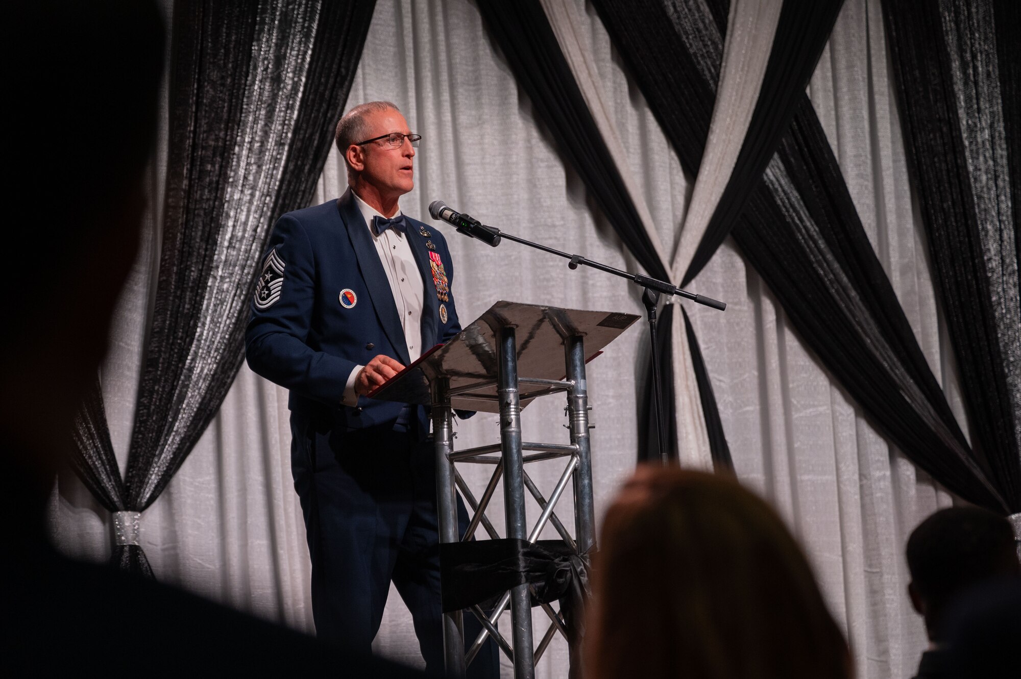 U.S. Air Force Chief Master Sgt. Heath Tempel, Alaskan North American Aerospace Defense Command Region and Alaskan Command, and Eleventh Air Force command chief, gives a speech during the Eielson Air Force Base’s annual Air Force Ball in Fairbanks, Alaska, Sept. 13, 2025.