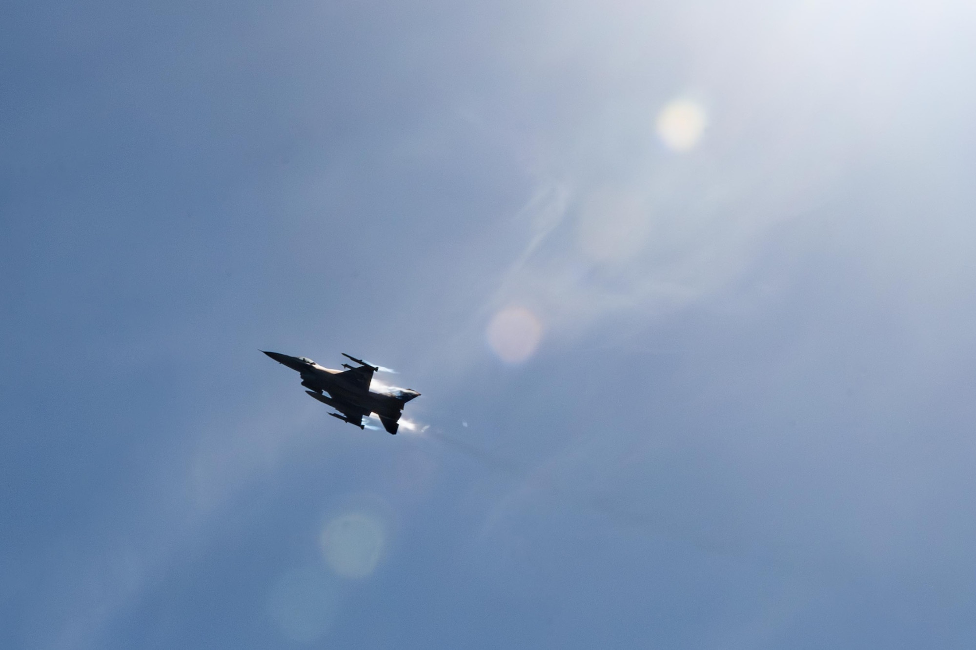 A U.S. Air Force F-16 Fighting Falcon assigned to the 14th Fighter Squadron flies over the crowd during Range Day 2025 at Draughon Range.