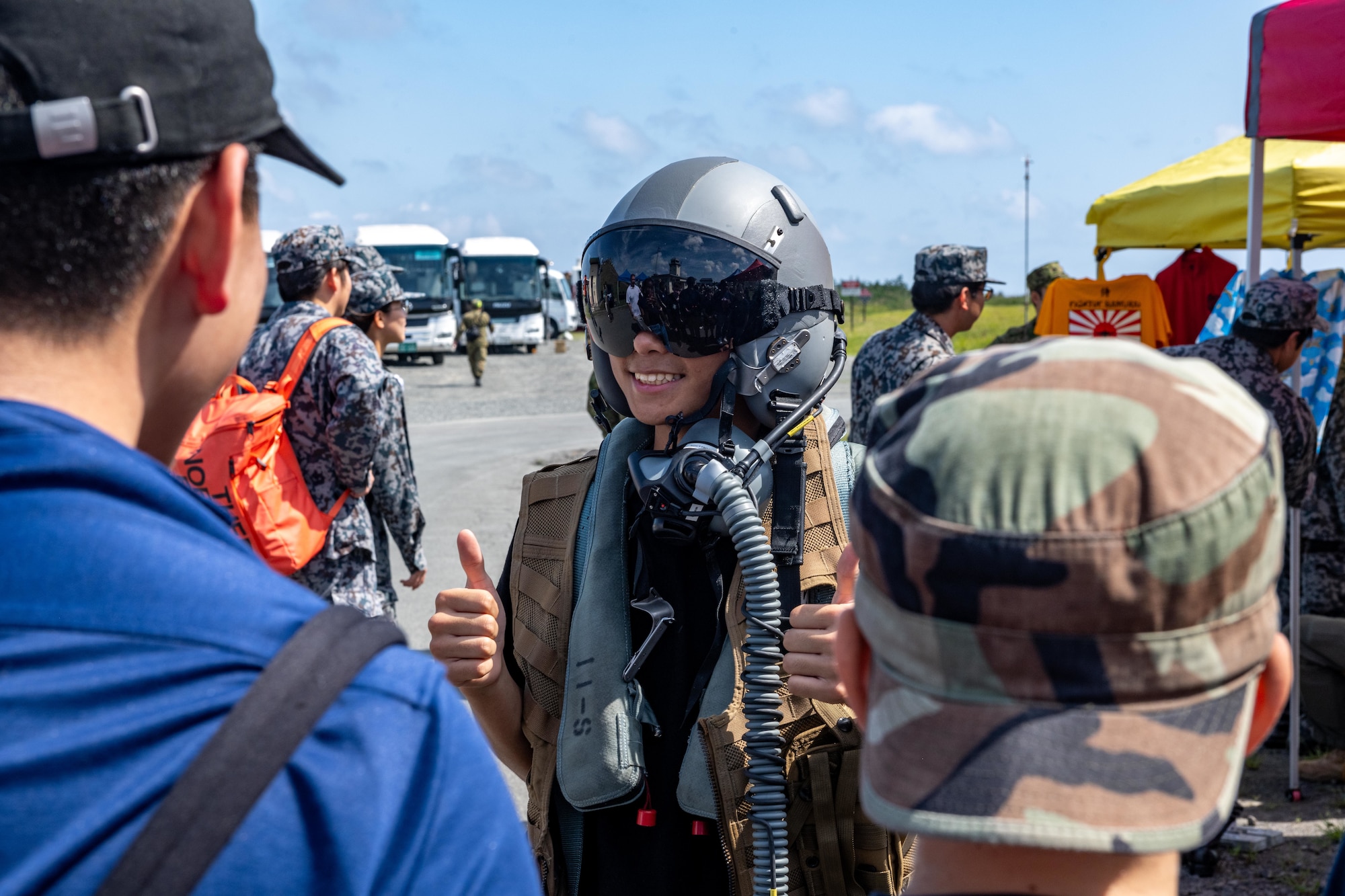 A student from Edgren High School poses for photos wearing gear utilized by U.S. Air Force F-16 Fighting Falcon pilots during Range Day 2025 at Draughon Range.