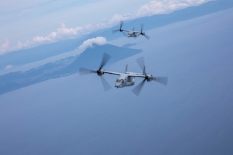 U.S. Marine Corps MV-22B Ospreys with Marine Medium Tiltrotor Squadron (VMM) 262, Marine Aircraft Group 36, 1st Marine Aircraft Wing fly in formation during exercise Resolute Dragon 25 off of the coast of Kagoshima, Japan, Sept. 12, 2025.