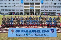 U.S. Air Force and Bangladesh Air Force participating in exercise Pacific Angel 25-3 sit and stand for a group photo at BAF Zahurul Haque, Chittagong, Bangladesh, Sept. 13, 2025.