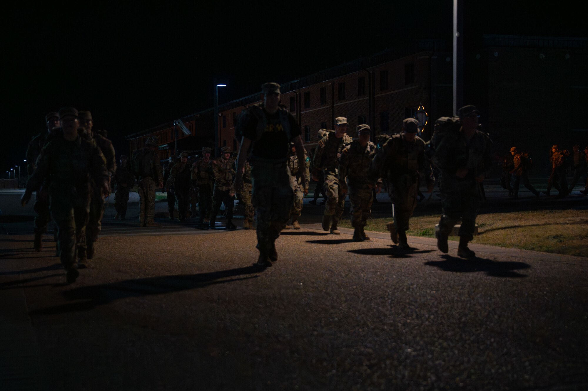 Army soldiers attached to the 344th Military Intelligence Battalion ruck during the 9/11 Memorial Physical Training Event at Goodfellow Air Force Base