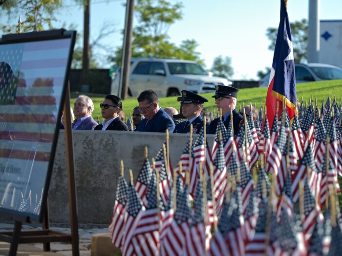 Bill Hayes, New York City Fire Department firefighter retired, Col. Jason Gerber, 17th Training Group commander, San Angelo Mayor Tom Thompson and other San Angelo city officials sit during the San Angelo 9/11 remembrance ceremony.