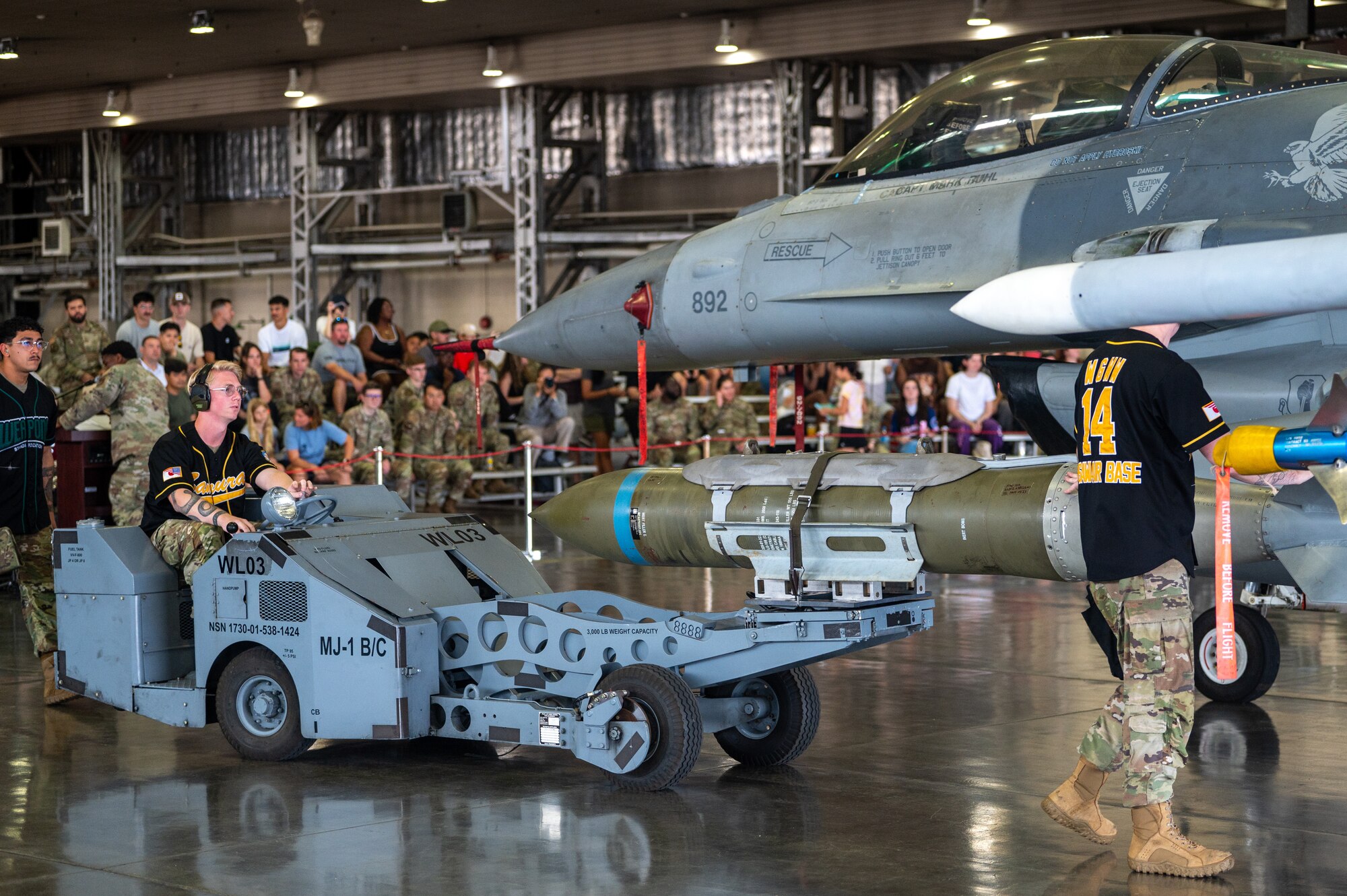 U.S. Air Force Airmen assigned to the 35th Maintenance Group use an MJ-1 Lift Truck to load munitions onto an F-16 Fighting Falcon during a demonstration at Misawa Air Base, Japan, Sept. 12, 2025.