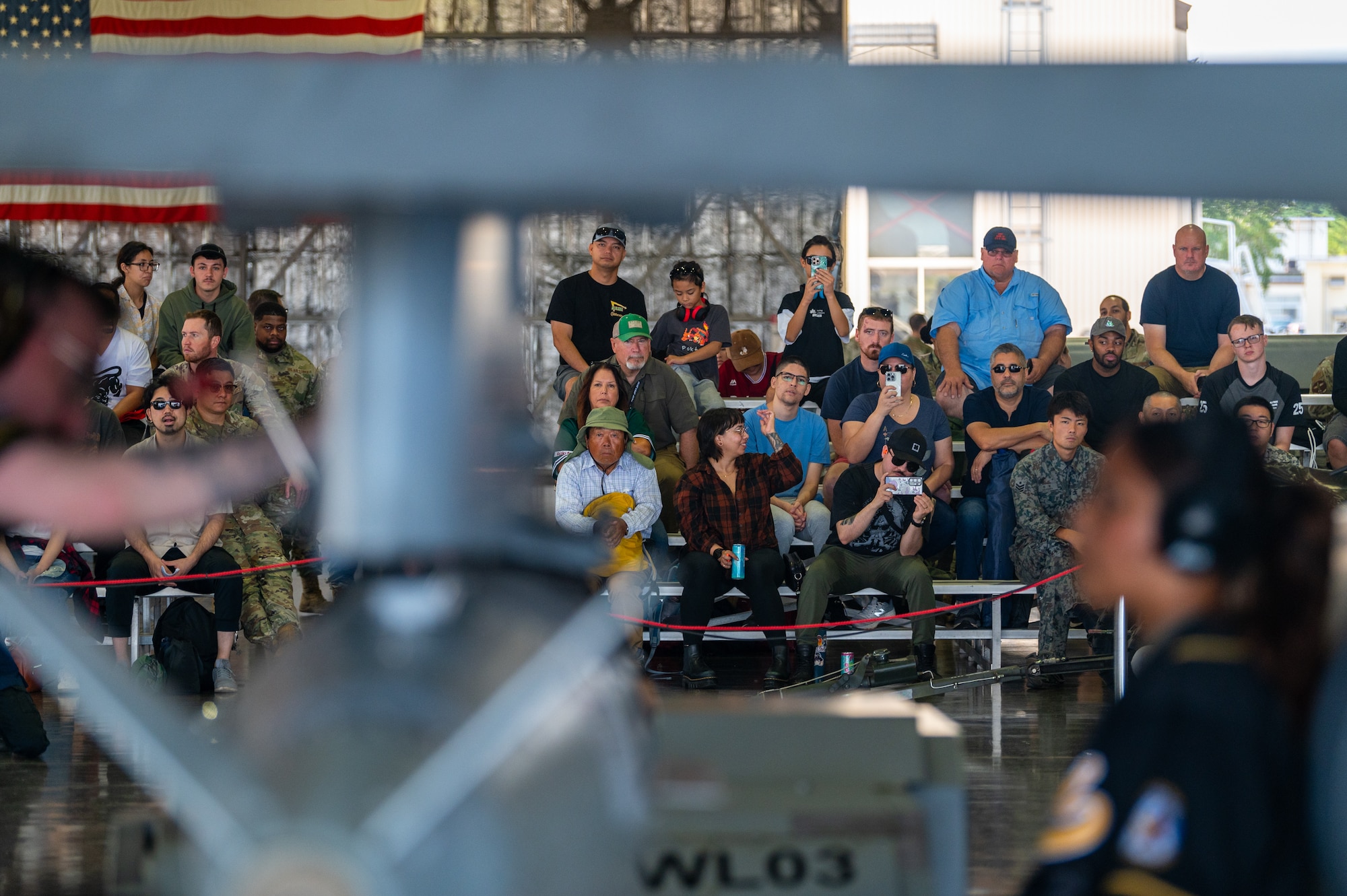 A crowd watches as Airmen assigned to the 35th Munitions Squadron load munitions onto an F-16 Fighting Falcon during a demonstration at Misawa Air Base, Japan, Sept. 12, 2025.