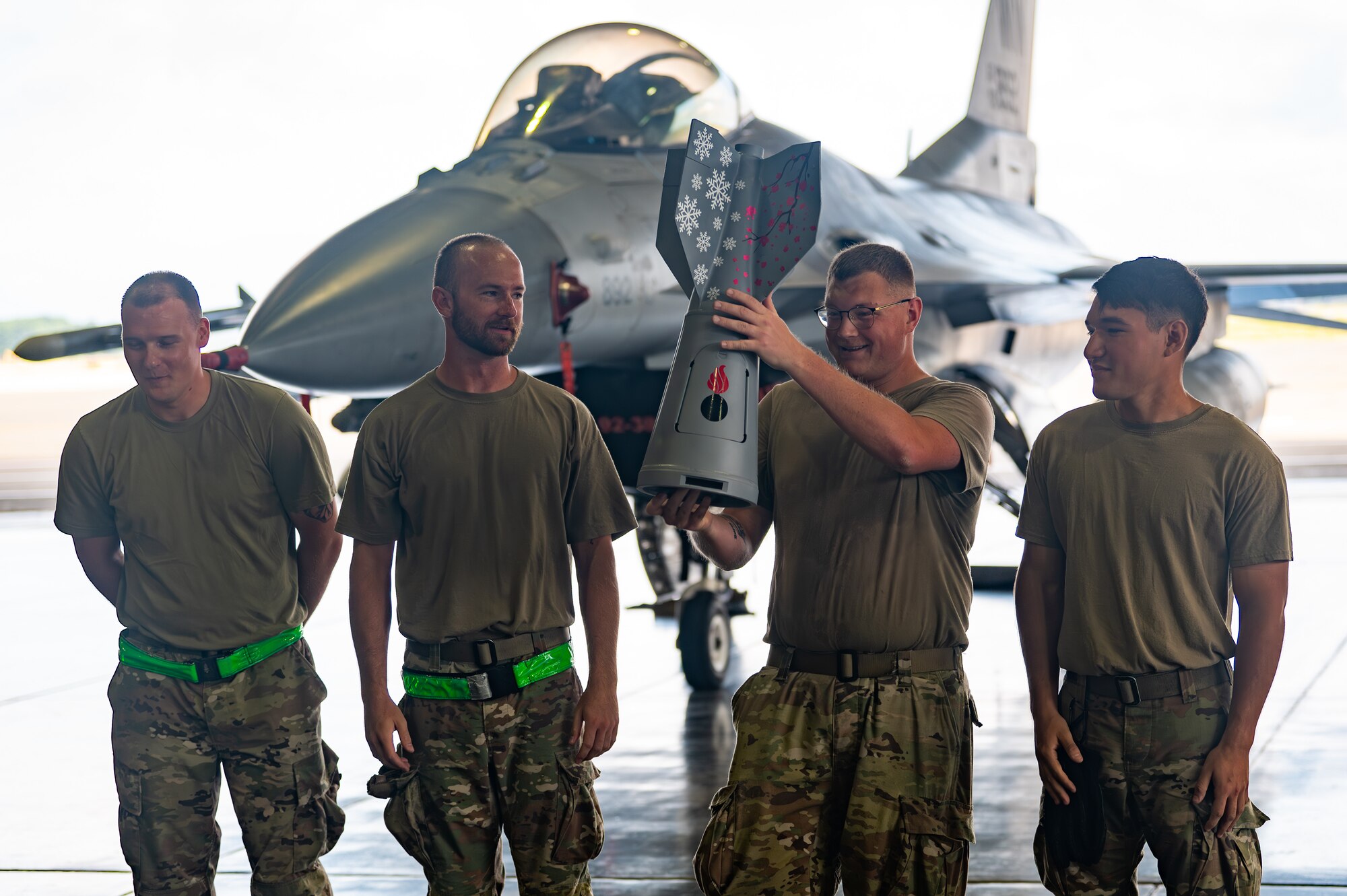 U.S. Air Force Airmen assigned to the 35th Munitions Squadron celebrate their victory after winning the bomb build portion of a load competition at Misawa Air Base, Japan, Sept. 12, 2025.