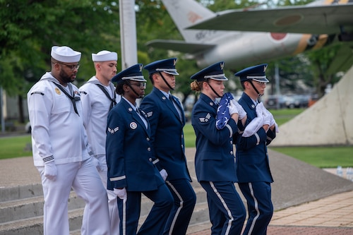 U.S. Air Force 35th Fighter Wing and U.S. Navy Naval Air Facility Misawa Honor Guard carry the U.S. and Japan Flags away during a 9/11 ceremony at Misawa Air Base, Japan. Sept. 11, 2025.