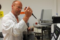 The 405th Army Field Support Brigade’s Army Oil Analysis Program (AOAP) laboratory in Kaiserslautern, Germany, officially shuttered its doors in accordance with an Army directive to cease operations due to funding. Consequently, all Army units in Europe will no longer be required to submit oil samples to the 405th AFSB’s AOAP lab but should submit special samples to the AOAP lab at Redstone Arsenal, Alabama. Pictured here, a physical science technician at AOAP Kaiserslautern tests oil samples in 2017. (File photo by then Staff Sgt. Alexander Burnett)