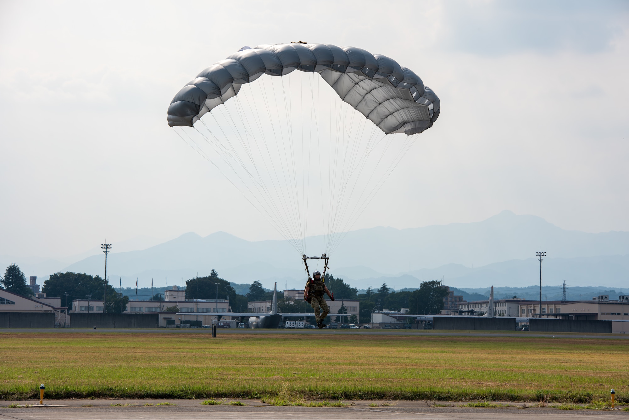 Service member prepares to land on the drop zone
