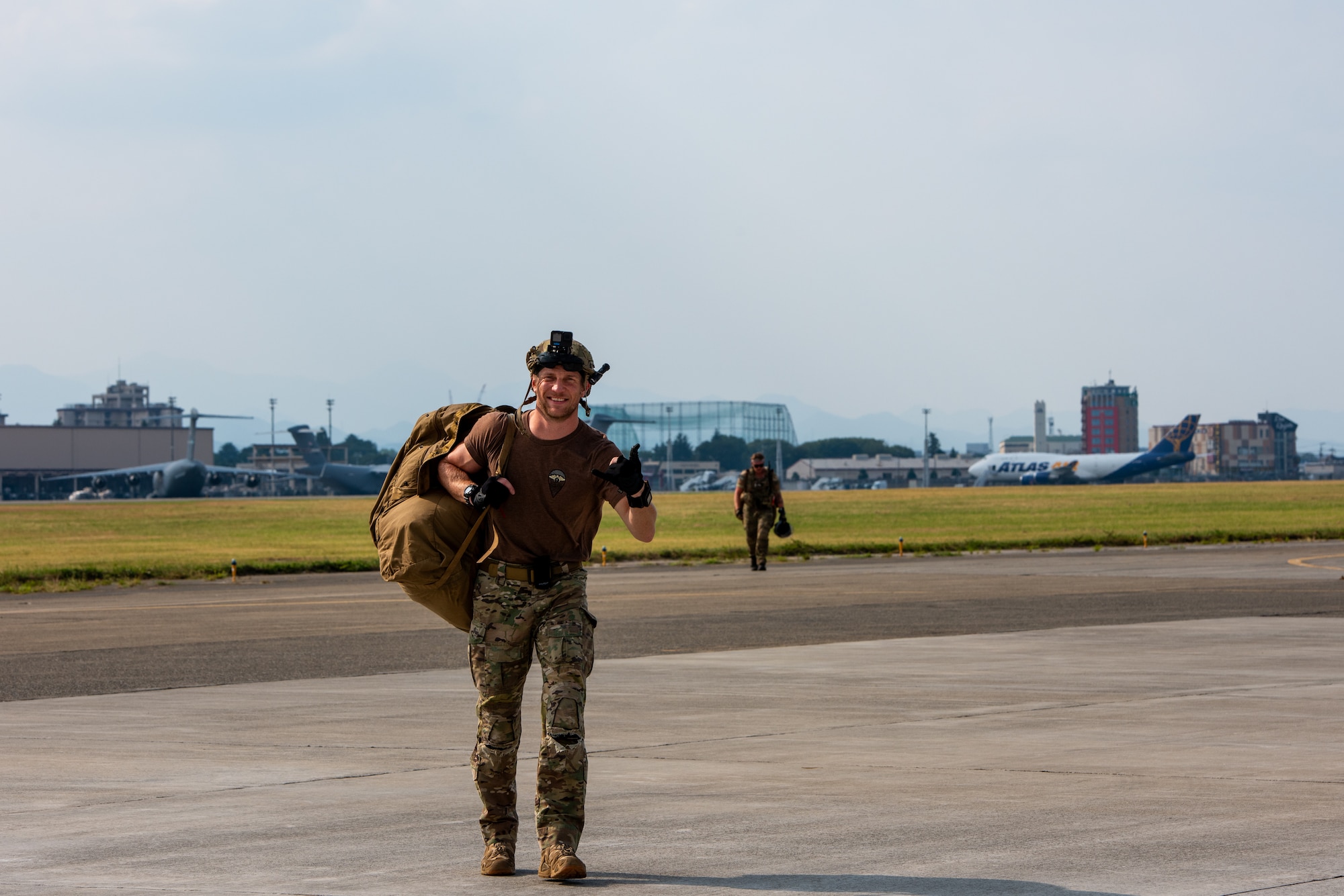 Service member  walks away from the drop zone.