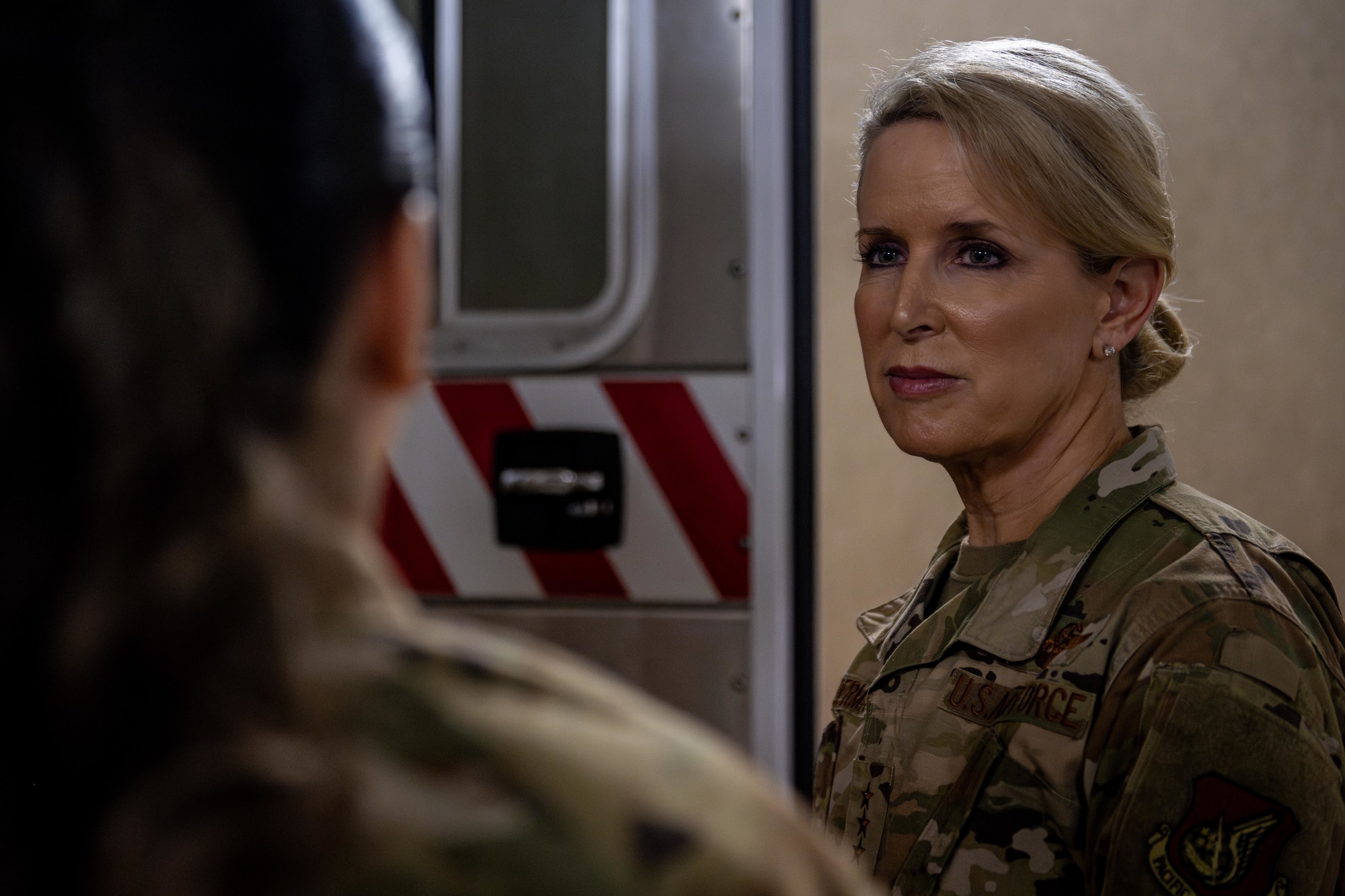 U.S. Air Force Lt. Gen. Laura Lenderman, right, Pacific Air Forces deputy commander, listens to a brief on 35th Medical Group (MDG) operations given by Senior Airman Alyssa Villegas, 35th MDG dental laboratory assistant, during a tour.