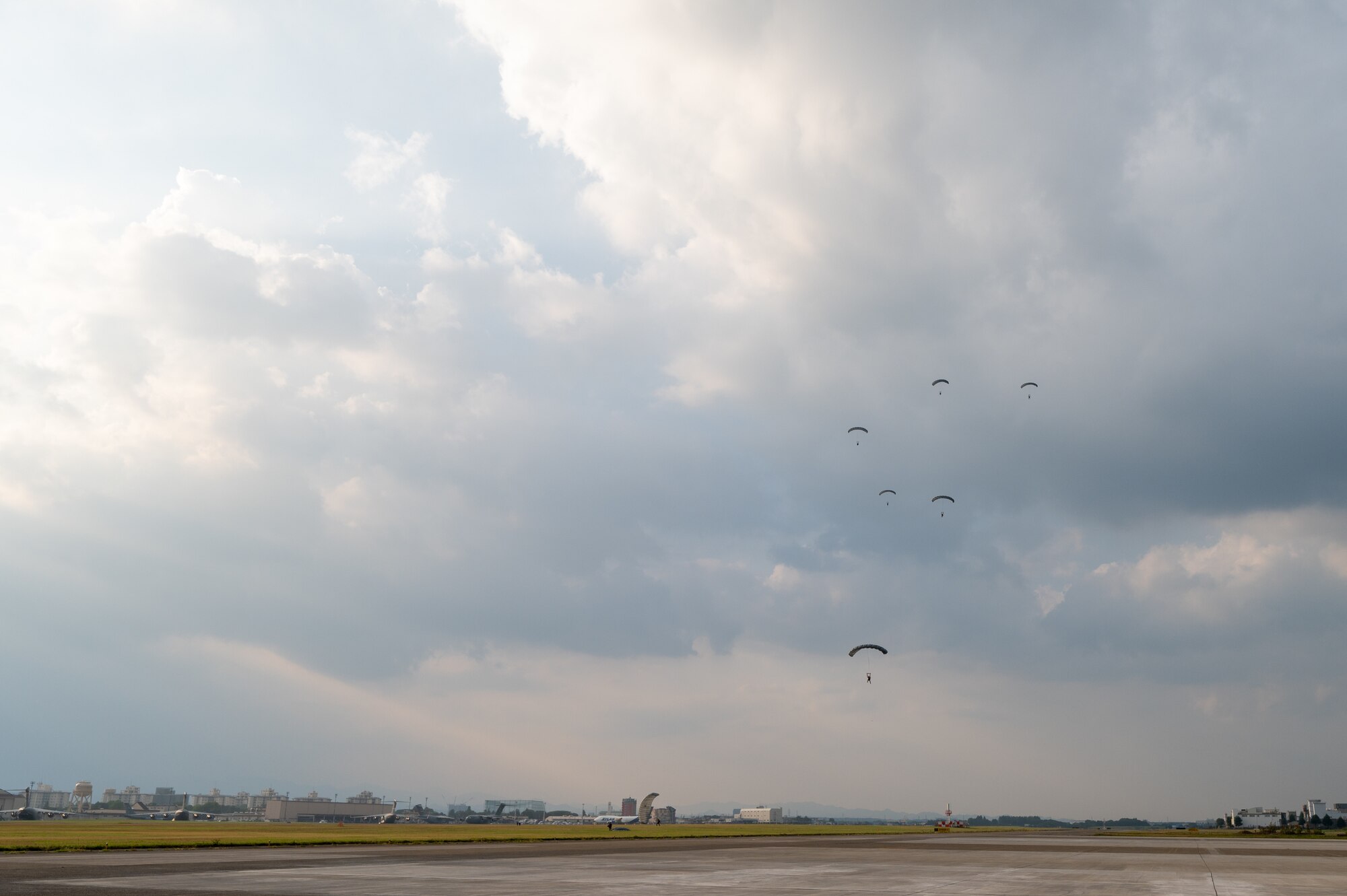 Service members descend onto the drop zone