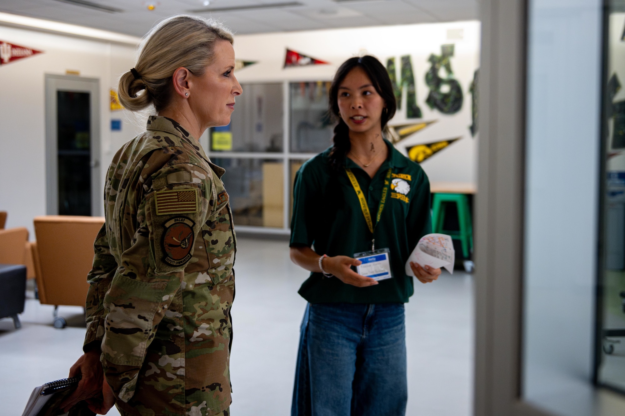 U.S. Air Force Lt. Gen. Laura Lenderman, left, Pacific Air Forces deputy commander, listens to a brief on high school operations from Kaleiana Alonza, Edgren High School senior class secretary, during a tour.