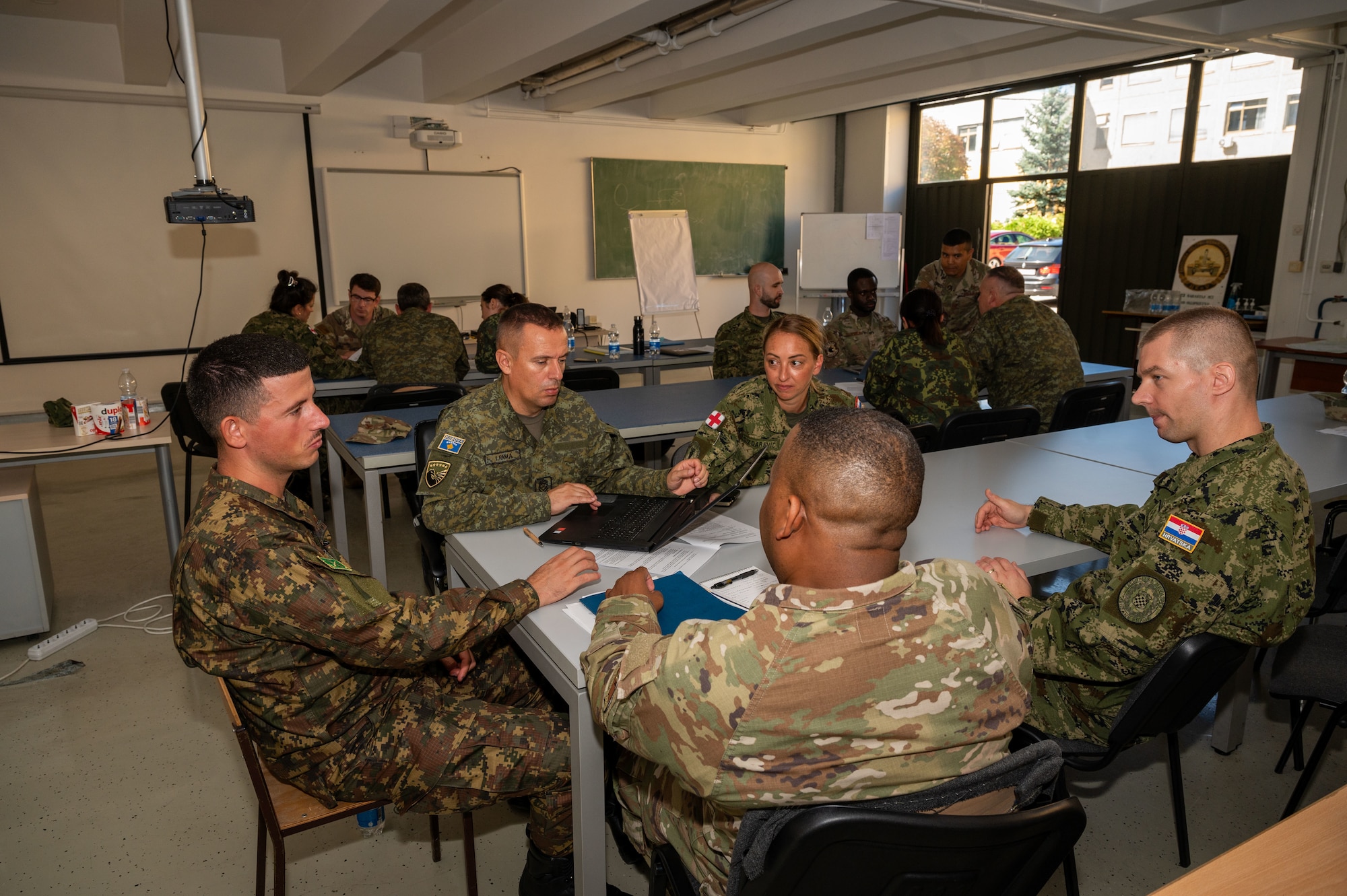 Participants gather in focus groups during a global health engagement at the Military Medical Center in Zagreb