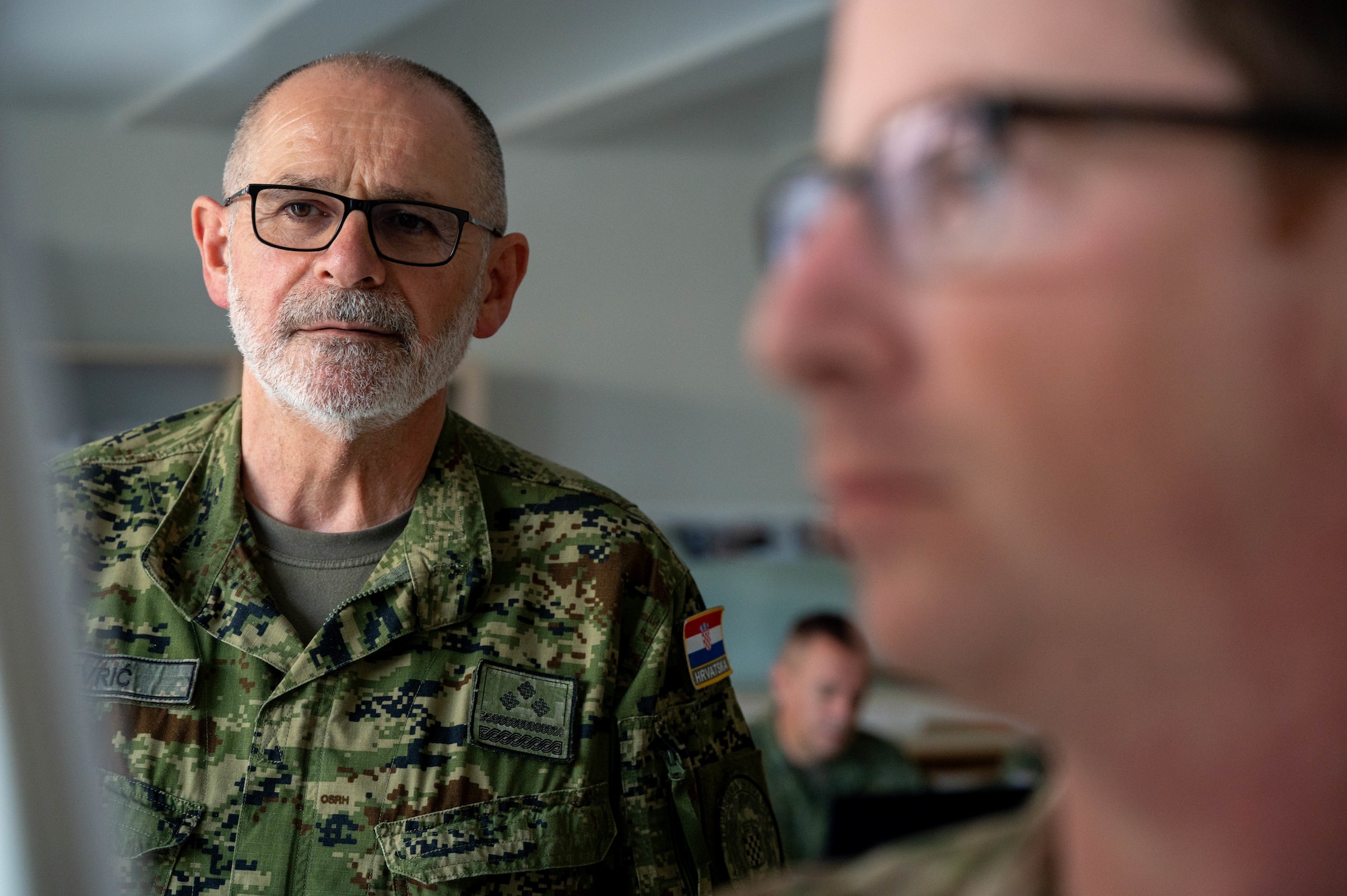 Col. Shime Kevric, Croatian army Role 2 medical commander, points to a patient tracking board during the development of the Role 2 standard operating procedure at the Military Medical Center in Zagreb