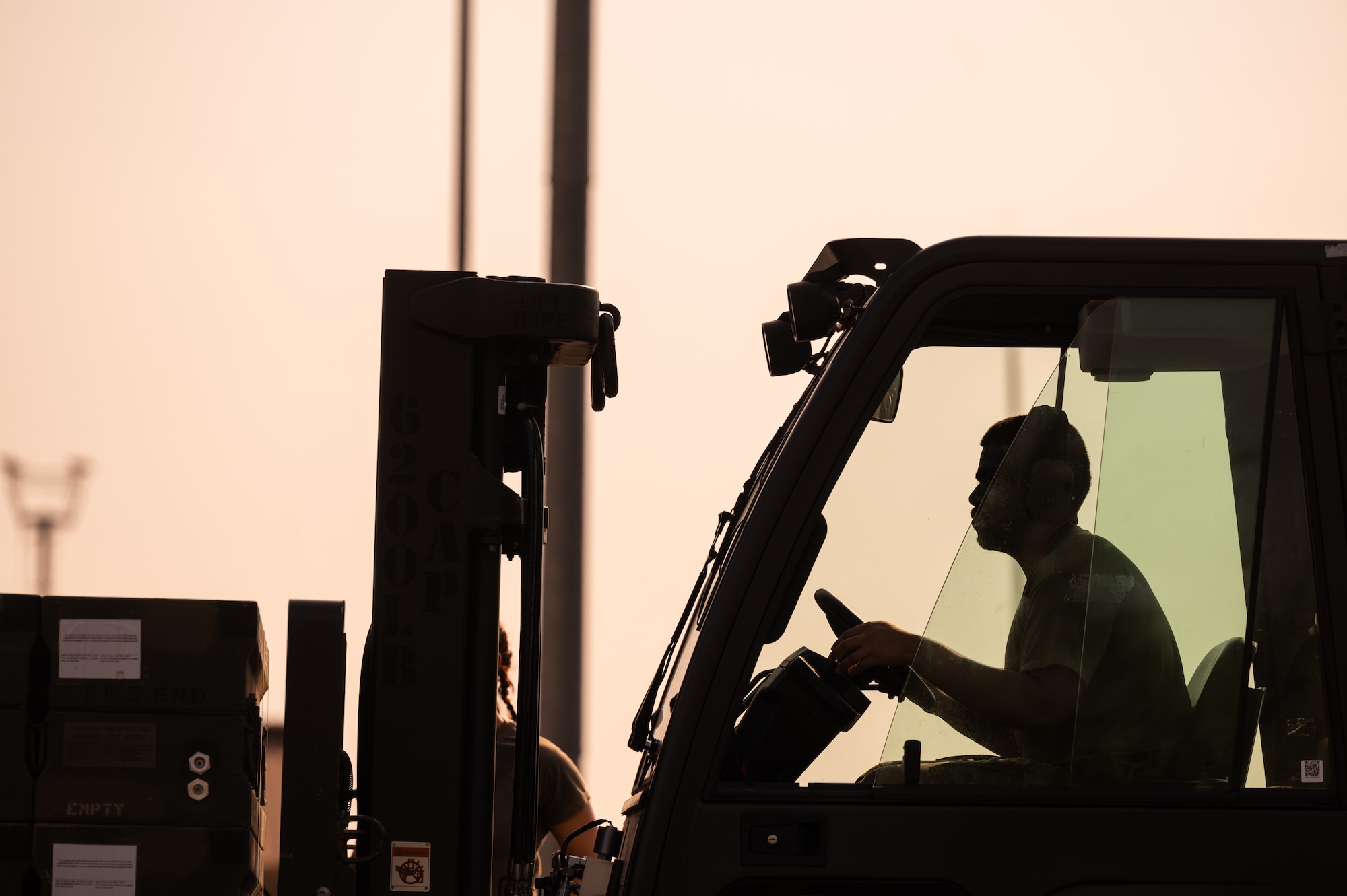 A U.S.  Airman assigned to the 86th Munitions Squadron drives a forklift during a timed exercise at Ramstein Air Base