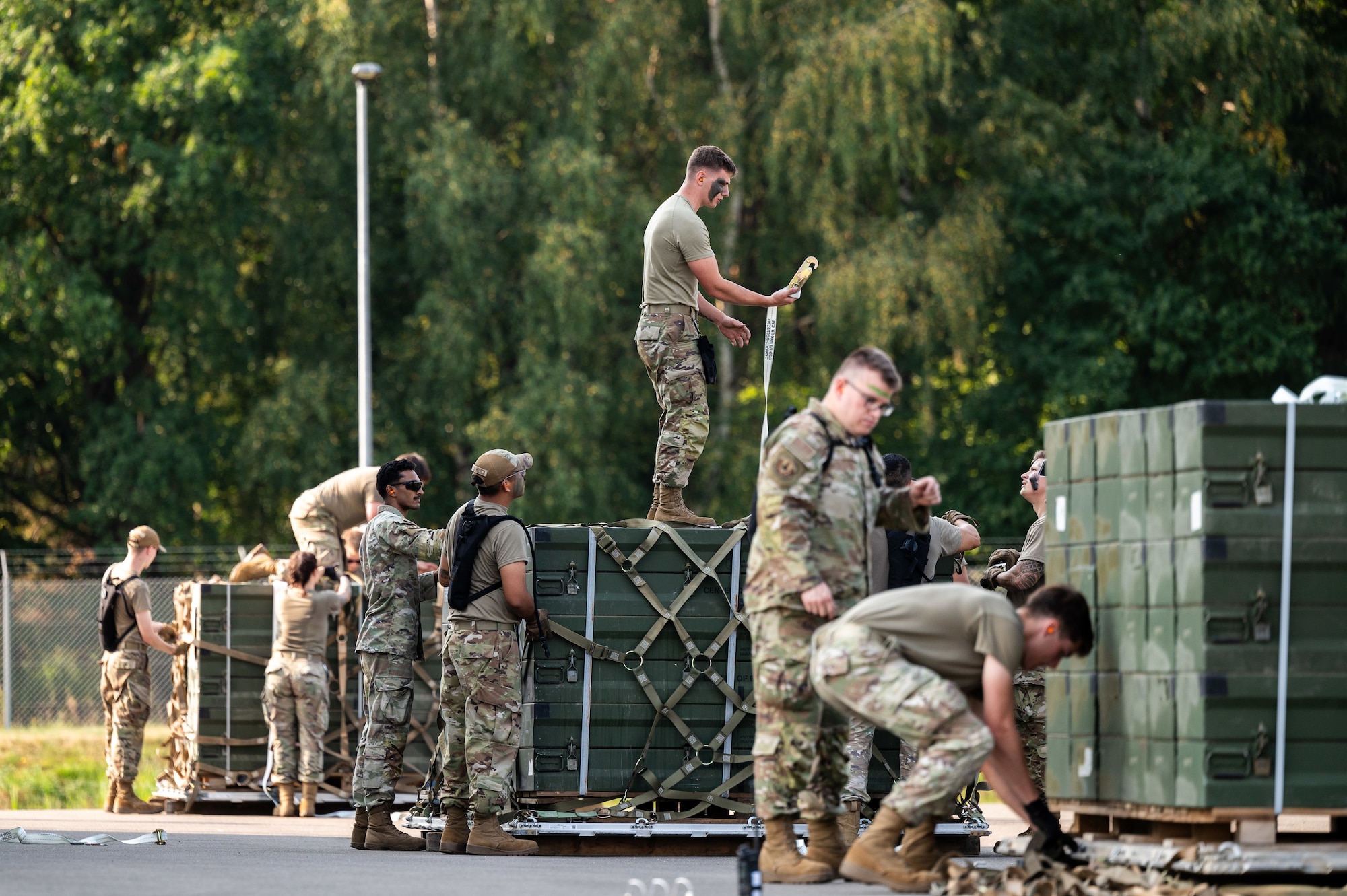The 86th Munitions Squadron exercise teams Reaper, Viper, and Havoc construct supply pallets in a timed challenge during an exercise at Ramstein Air Base