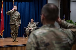 U.S. Air Force Maj. Kristopher Atabaki, 39th Communications Squadron incoming commander, renders his first salute to squadron members during an assumption of command ceremony at Incirlik Air Base, Türkiye, Sept. 15, 2025. Through the first salute, the squadron formally recognizes its new commander and reaffirms the bond of mutual respect and unity between leaders and Airmen. (U.S. Air Force photo by Senior Airman Greydon Furstenau)