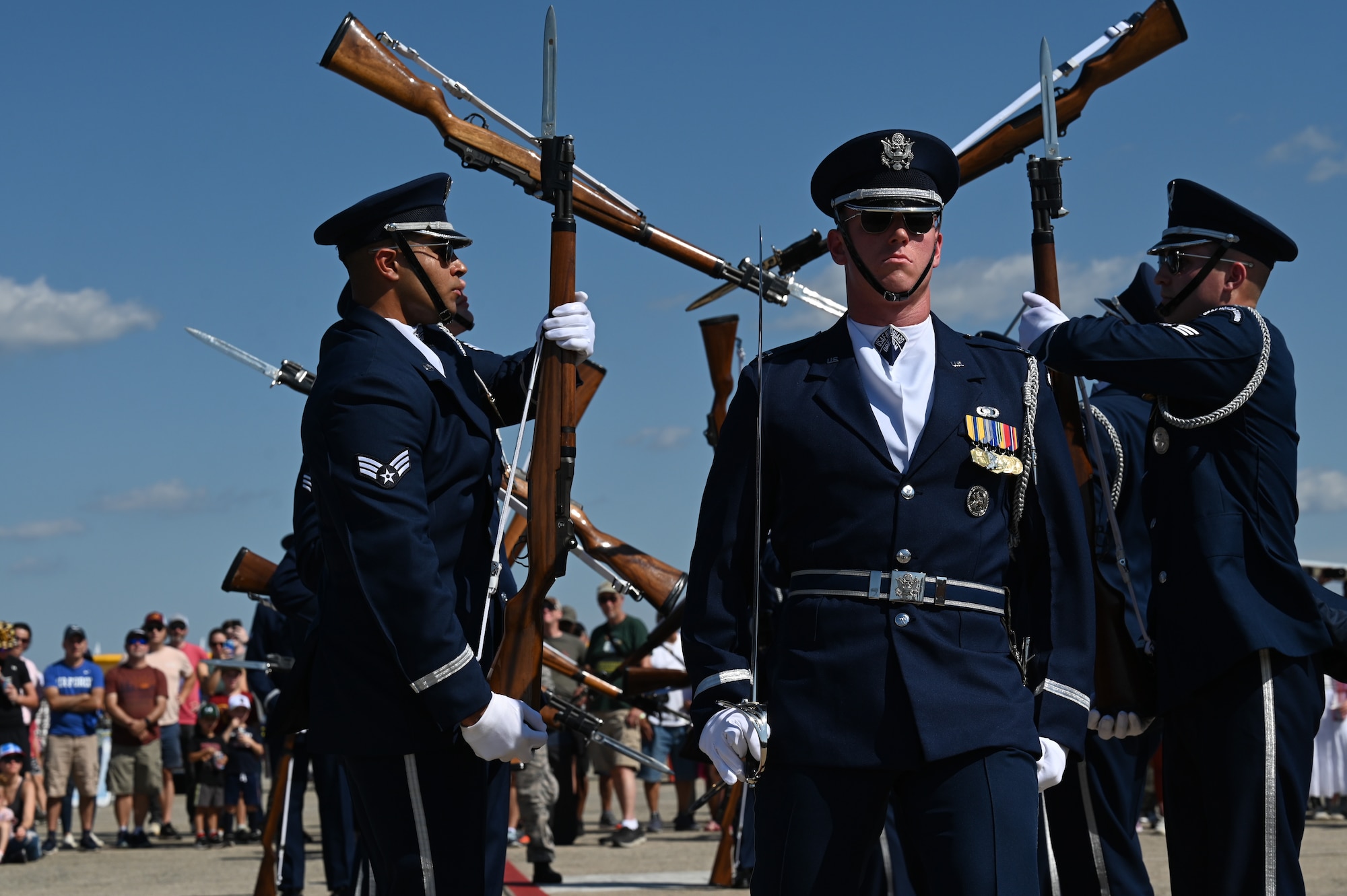 The U.S. Air Force Honor Guard Drill Team performs during the 2025 Joint Base Andrews Air Show at Joint Base Andrews, Maryland, Sept. 13, 2025. The air show features U.S. military and civilian aerial demonstrations, static displays, and opportunities for the public to engage with service members, honoring the legacy of aviation excellence while inspiring the next generation of aviators and aerospace innovators. (U.S. Air National Guard photo by Tech. Sgt. Missy Sterling)