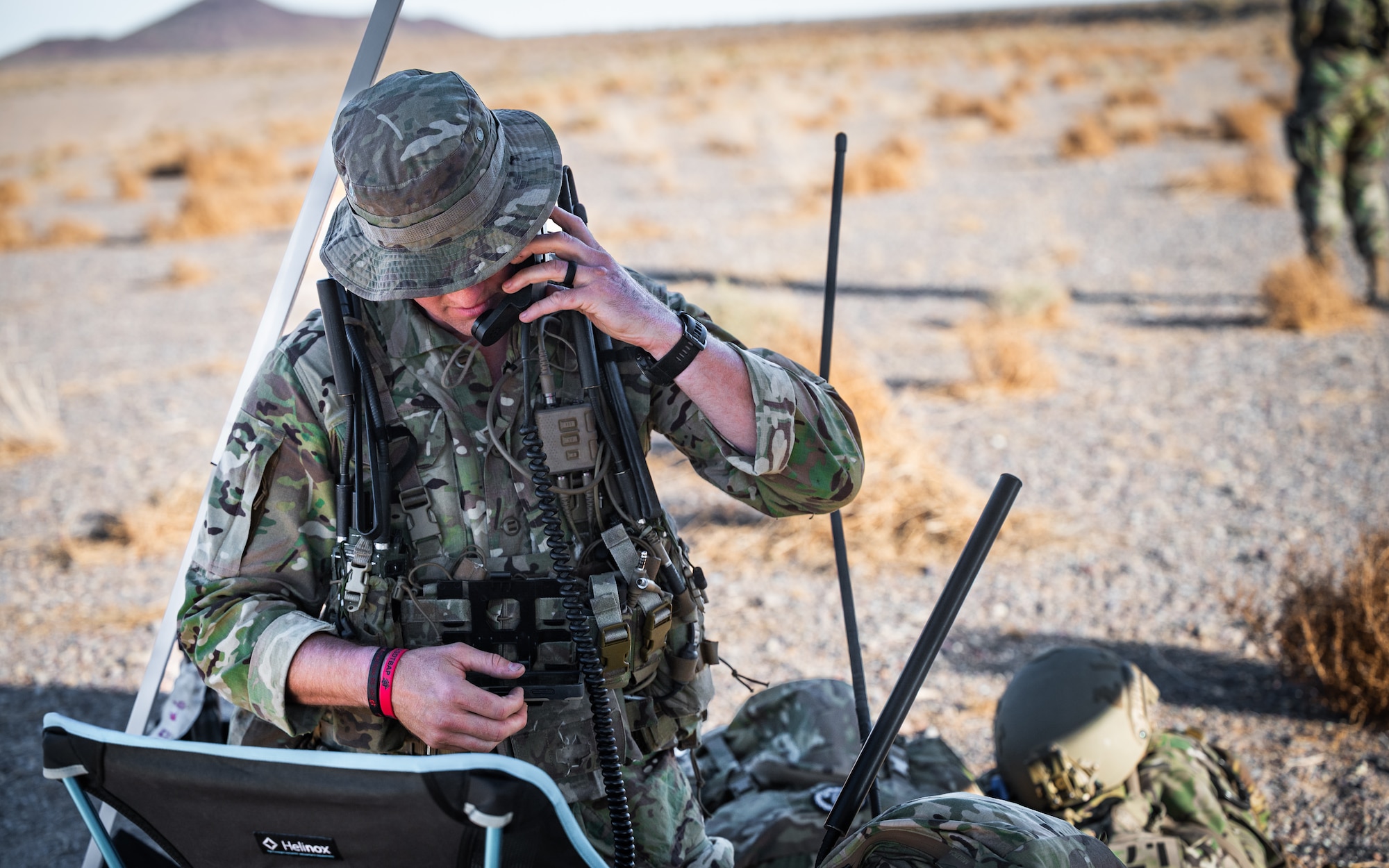 A U.S. Air Force Air Commando assigned to Air Force Special Operations Command communicates on a satellite radio during an airfield survey as part of Emerald Warrior 25.2 in California, July 24, 2025.