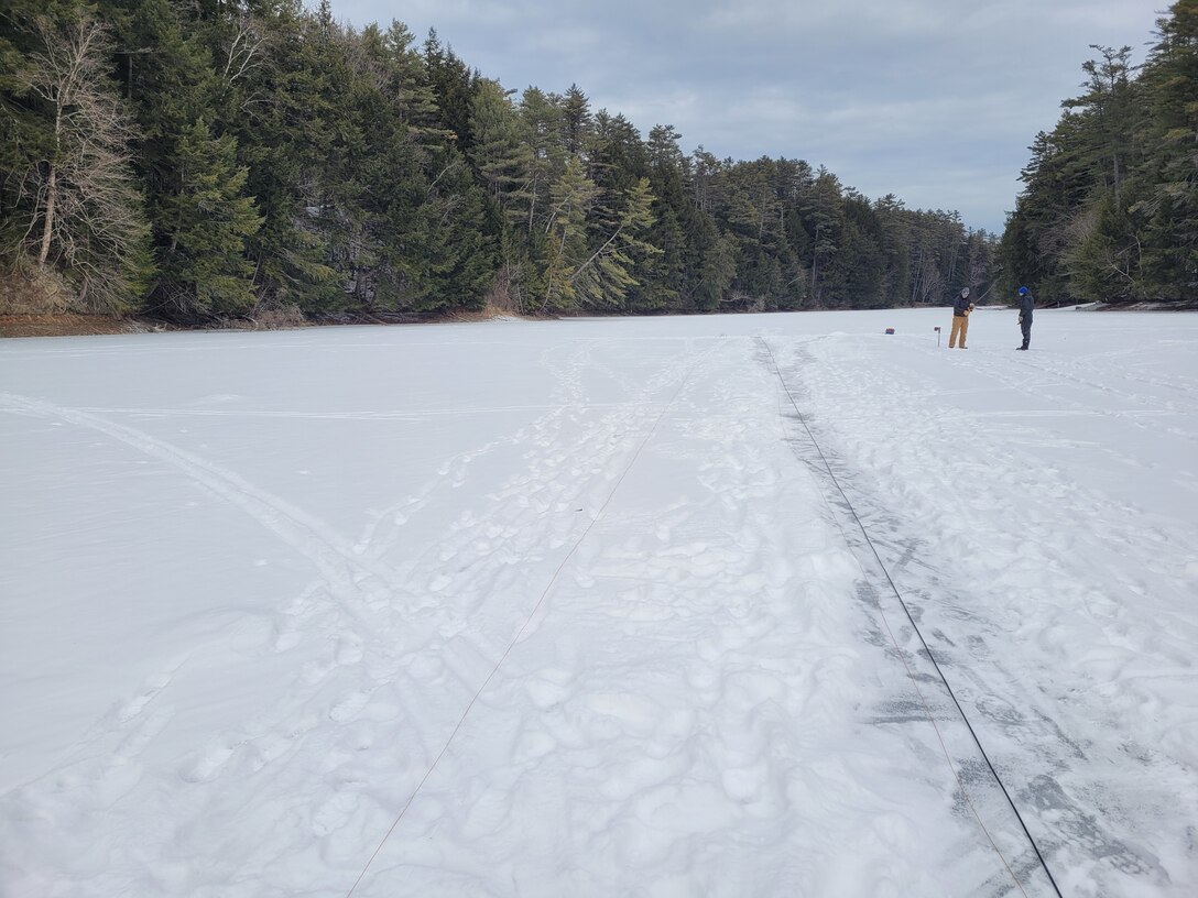 CRREL researchers test DAS-Ice on Storrs Pond in Hanover, New Hampshire. DAS-ICE turns a fiber-optic cable laid onto the ice surface into a vibration monitoring sensor that can be used to determine freshwater ice thickness.