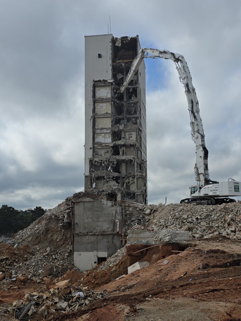 A multi-storied facility being torn down.