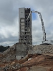 A multi-storied facility being torn down.