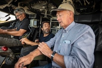 From left, Captain Al Frontin, Amitai Peleg, SEALARTEC CEO, and Dennis Danko, Stiletto Program Manager, discuss logistics of an autonomous boat launch and recovery demonstration in the pilothouse Stiletto in Norfolk, Virginia, on June 2, 2025.
