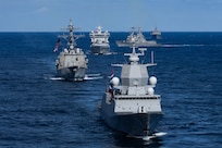 From front, Norwegian Navy Frigate HNoMS Thor Heyerdahl (F314), Arleigh Burke-class guided-missile destroyer USS Bainbridge (DDG 96), Norwegian Navy replenishment oiler HNoMS Maud (A 530), Arleigh Burke-class guided-missile destroyers USS Mahan (DDG 72) and USS Winston S. Churchill (DDG 81), and fast-combat support ship USNS Supply (T-AOE 6), sail in formation, Aug. 23, 2025.