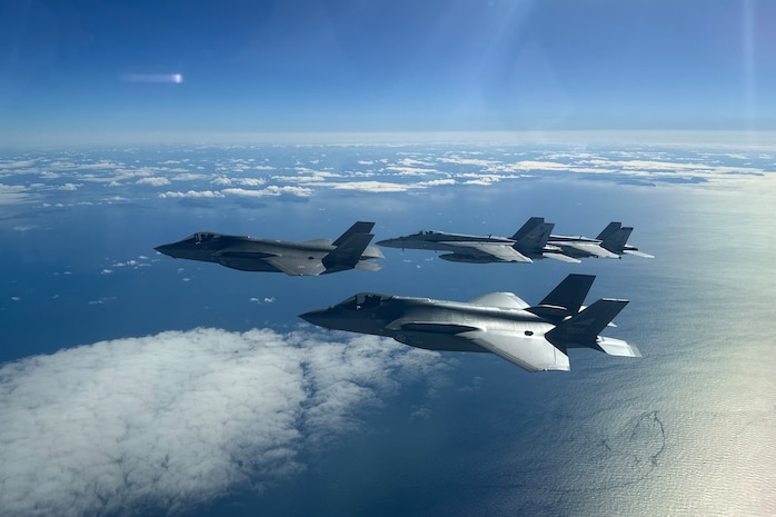 U.S. Carrier Air Wing 8 F/A-18E/F Super Hornets, attached to Strike Fighter Squadrons 31 and 213 aboard USS Gerald R. Ford (CVN 78), fly in formation off the western coast of Norway with Royal Norwegian Air Force F-35 Lightning II aircraft from Ørland Main Air Station, Aug. 25, 2025.