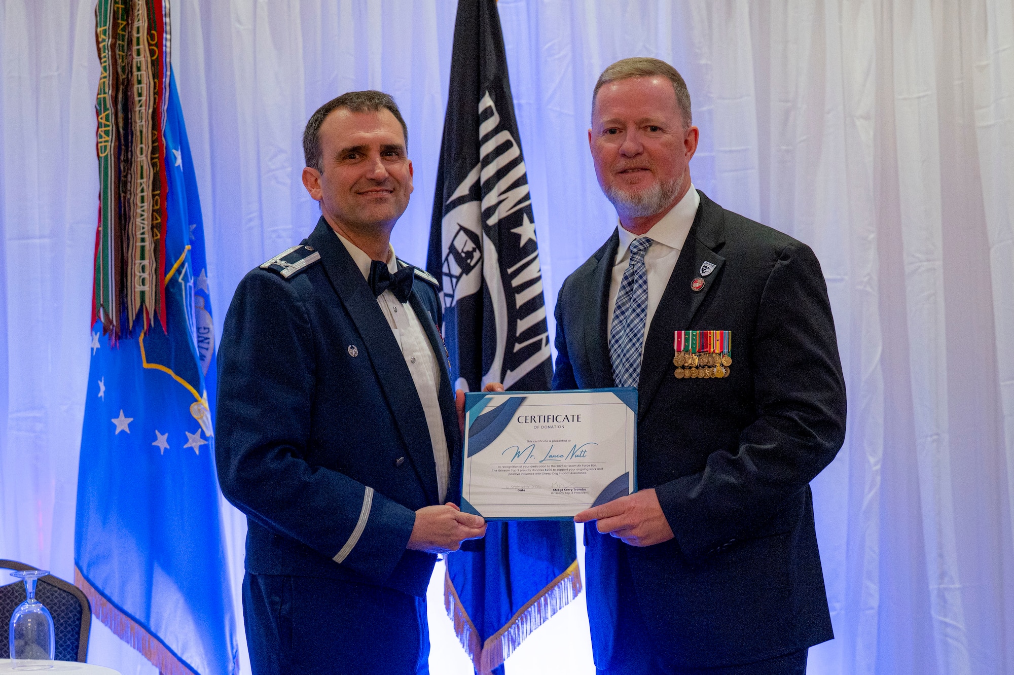434th Air Refueling Wing commander presents event guest speaker with a certificate