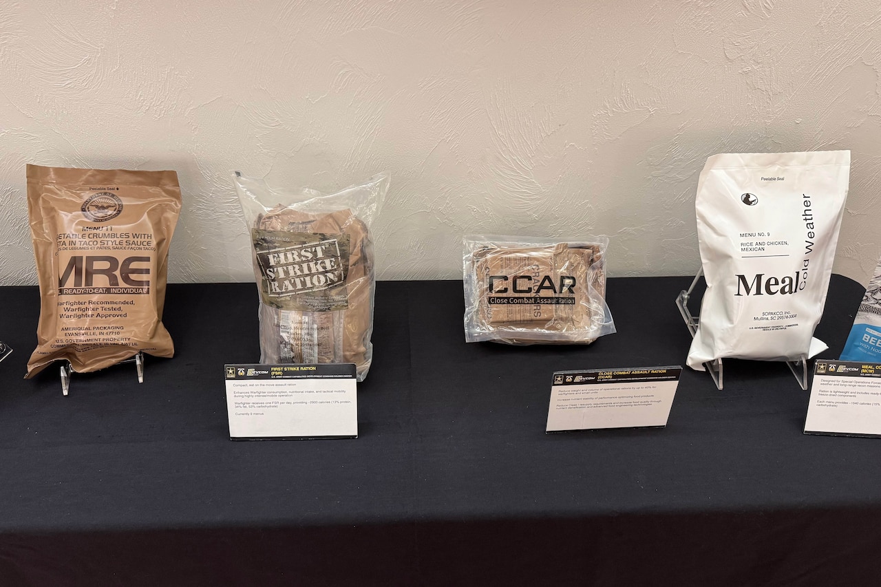 Four plastic-wrapped packages sit on a display table.